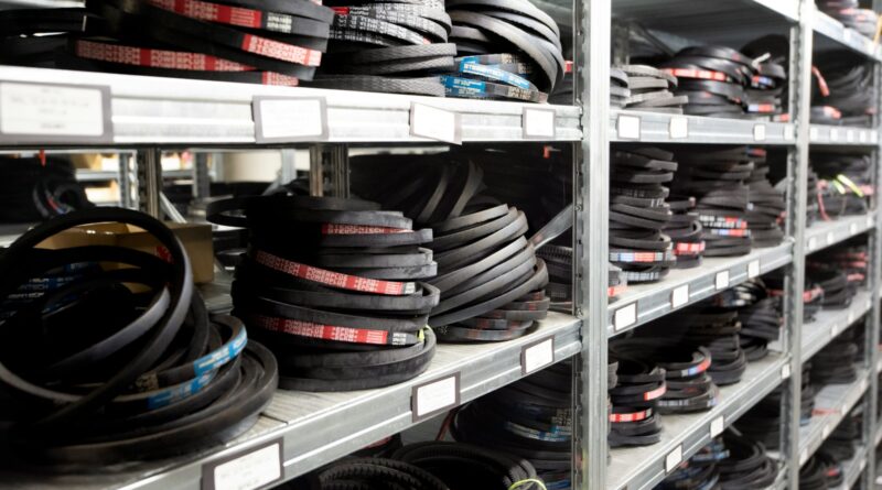 a bunch of tires are stacked on a shelf